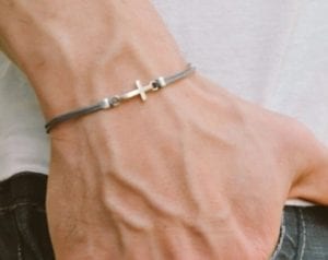 thin rope bracelet with cross charm