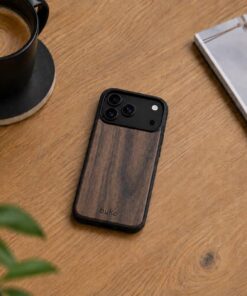 buko walnut wood case on a light brown wooden desk with a coffee, plant and magazine.