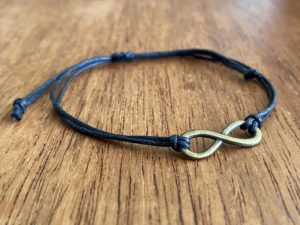Black rope bracelet with infinity charm