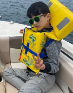 Boy wearing green wooden sunglasses
