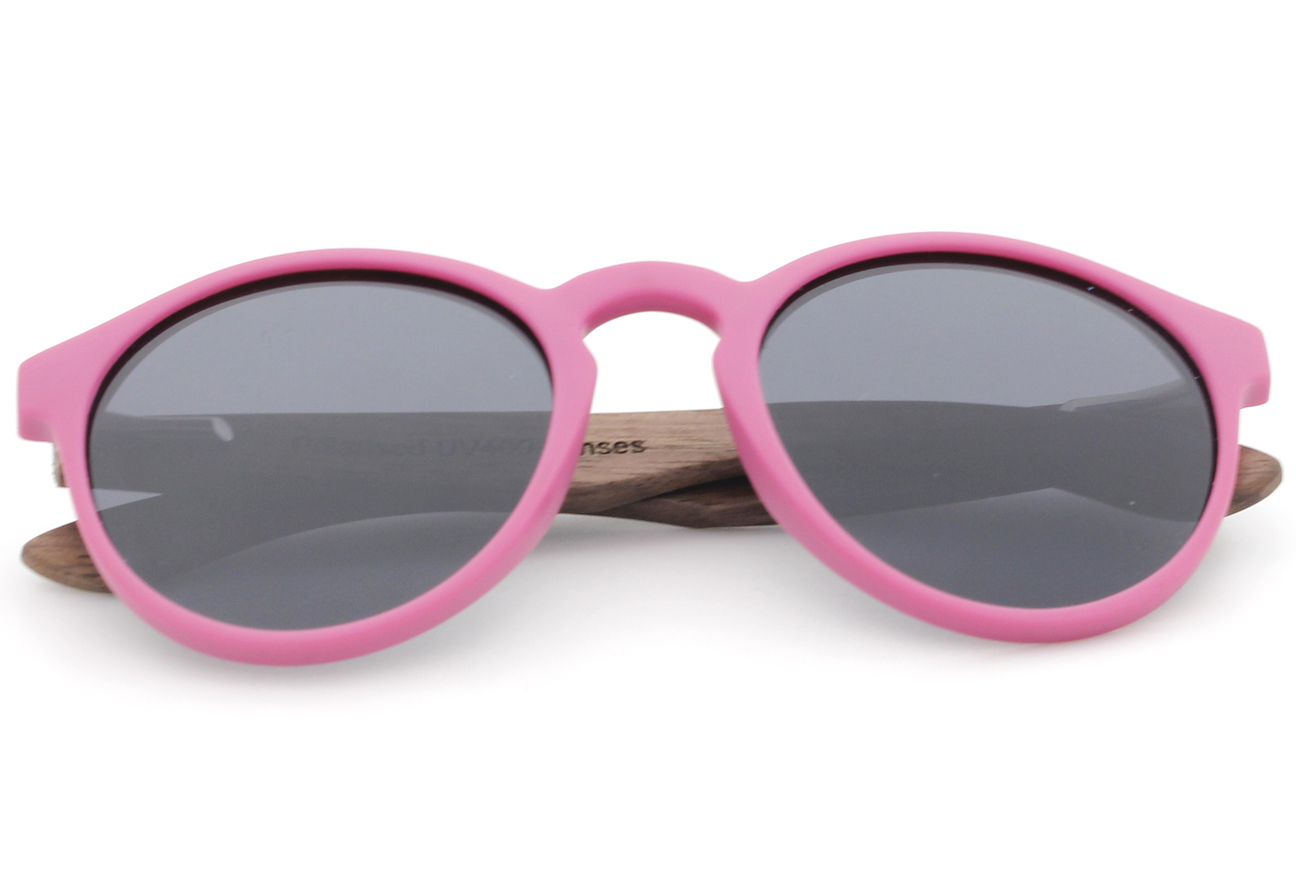Kids pink wooden sunglasses folded