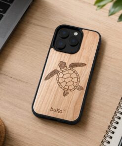 BuKo turtle wood phone case on a modern desk with laptop, coffee, notebook, pen and plant