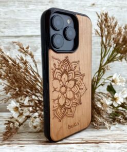Wooden phone case with mandala engraved and dried flowers in background