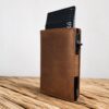 brown leather pop up wallet with side button by buko