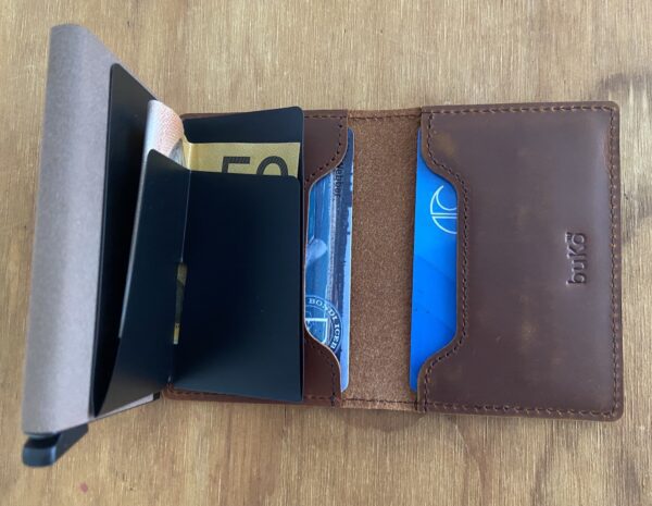 Inside leather trigger pop up wallet