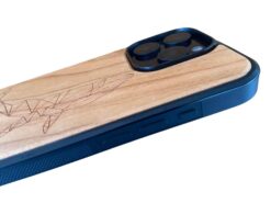Side of wooden phone case with whale engraving