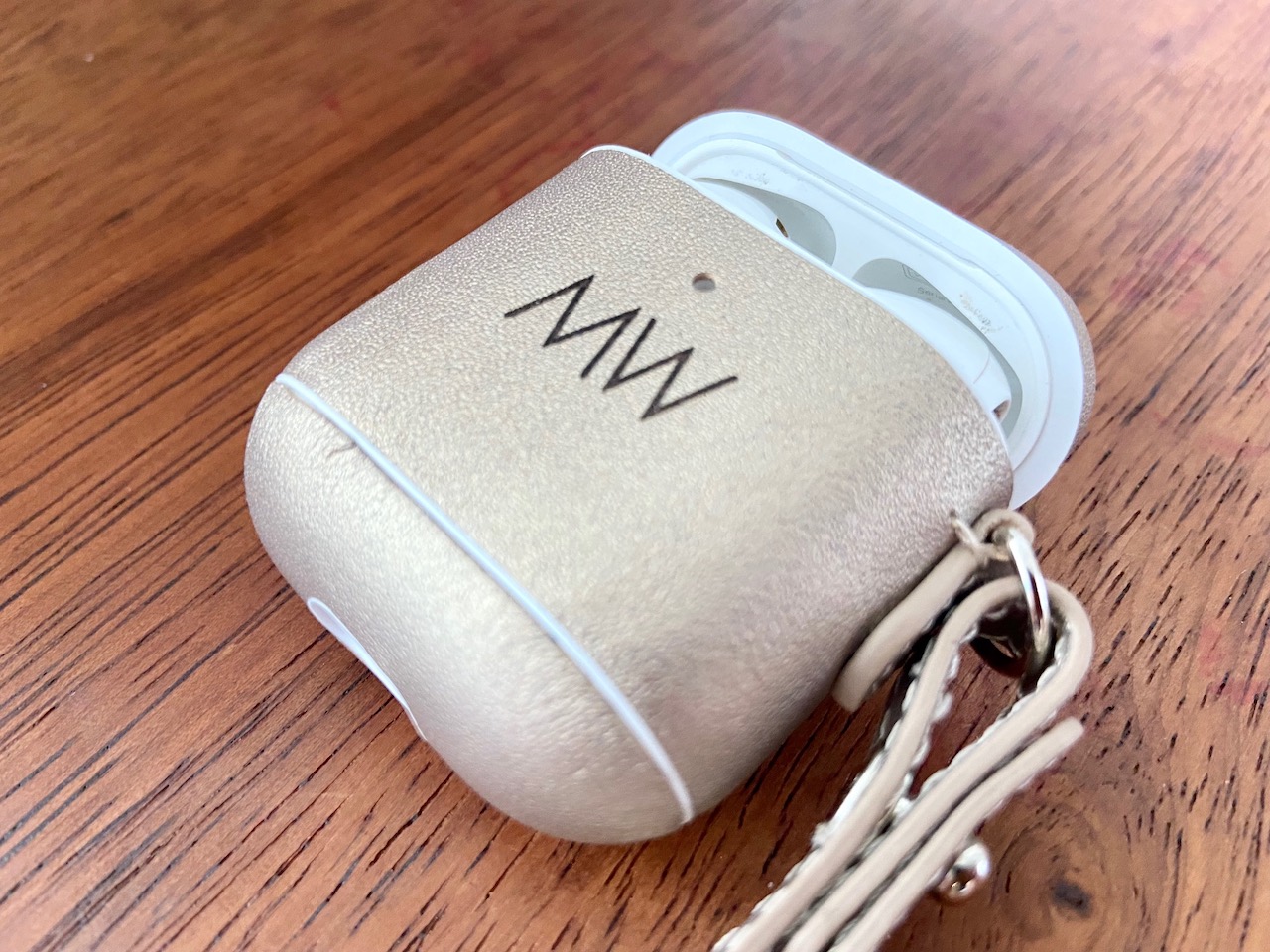 gold leather AirPods case with personalisation
