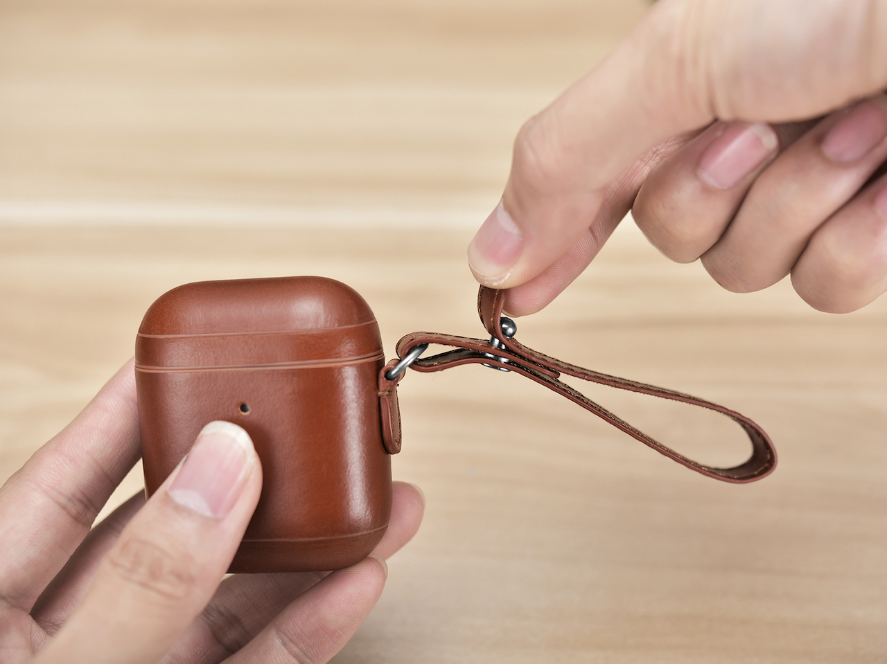 Leather strap on AirPods case