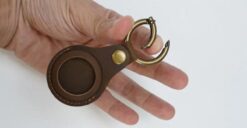 Finger showing how keyring opens