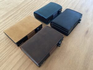 Four colours of double pop up wallets
