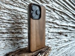 walnut wood phone case on iPhone 16 pro with whitewashed wood background