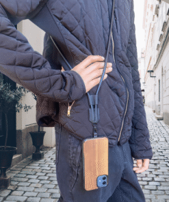 Woman wearing a leather crossbody phone strap lanyard