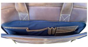 Outside pocket of leather laptop case showing stationery holders inside