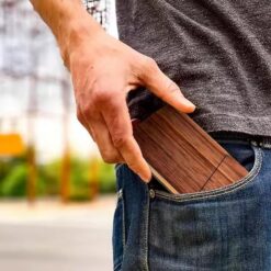 Wooden business card holder in mans pocket