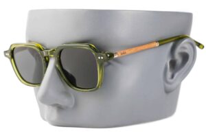 avie fade green sunglasses with wood arms on model