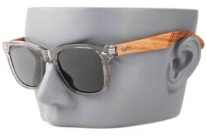 runaway fade wooden sunglasses with grey lenses on a male model