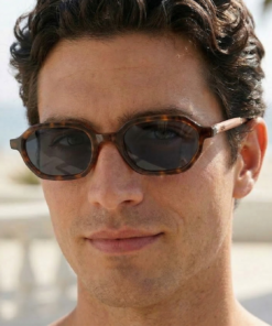 Sierra sunglasses with grey lenses by buko on a male model by the beach