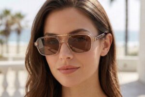 brando champagne sunglasses on a female model with palm trees in background