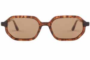 Front angle of BuKo Sierra sunglasses with tortoiseshell acetate geometric frame, grey polarised lenses and natural wooden temples on a white background.