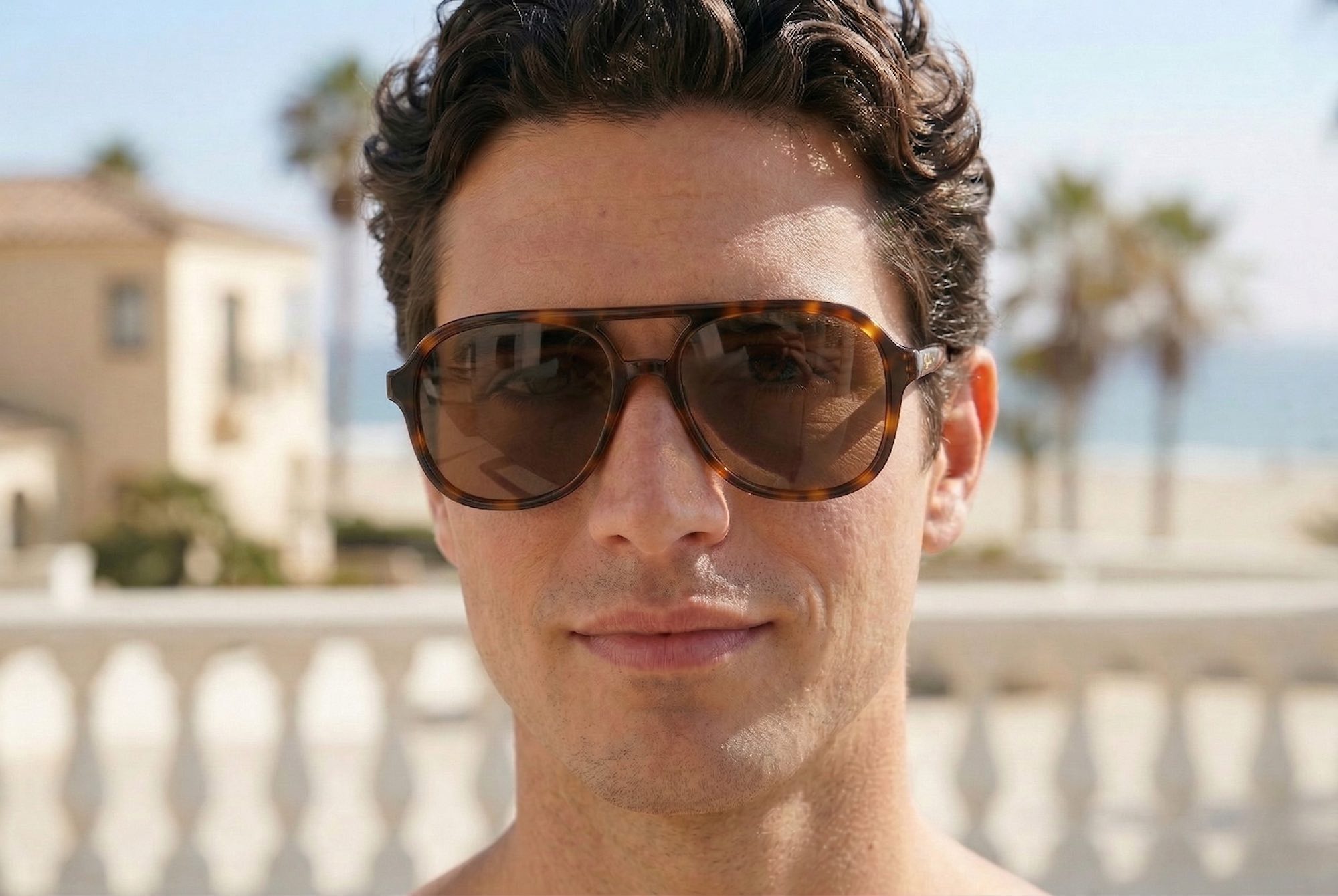 Male model wearing Buko Wategos sunglasses in tortoiseshell acetate frame with brown polarised lenses, retro aviator style with arched double bridge