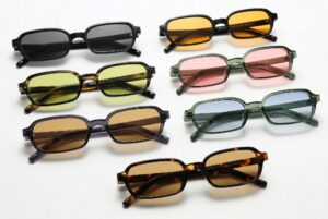 Cannes sunglasses by Buko in multiple colour options featuring slim rectangular acetate frames with tinted lenses on white background