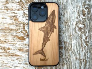 Wood phone case with engraved shark design featuring Sydney beach names including Bondi, Coogee and Manly by Buko