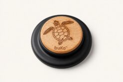 buKo MagSafe Phone Holder & Stand with engraved turtle design on natural wood and matte black base