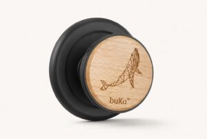 buKo MagSafe Phone Holder & Stand with geometric whale engraving on natural wood and matte black base